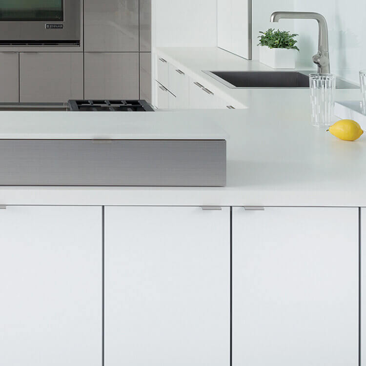 White glossy acrylic cabinets and Gray wired gloss cabinets in an ultra modern kitchen design.