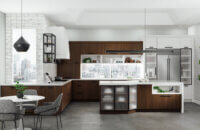 A urban city loft kitchen with walnut cabinets, a white painted modern wood hood, matte black metal cabinet doors, and floating shelves create an industrial look.