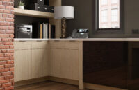 A home office desk corner in a modern urban home with quarter-sawn white oak cabinets.