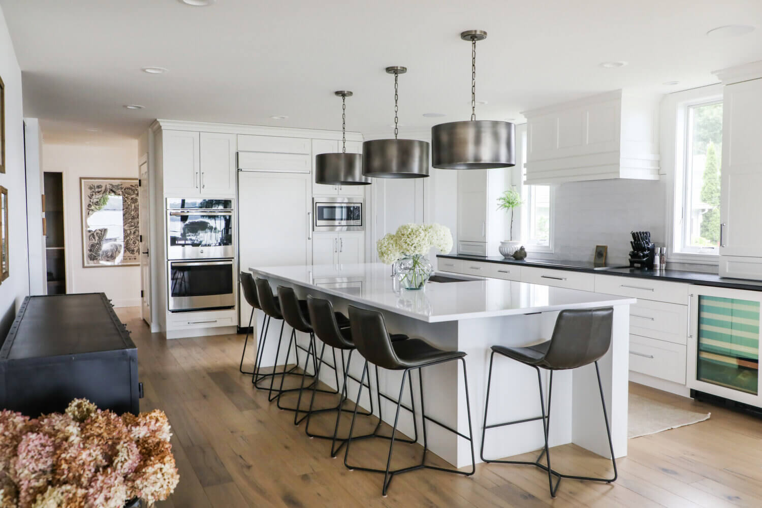 A custom white painted kitchen design matched to a Benjamin Moore color.