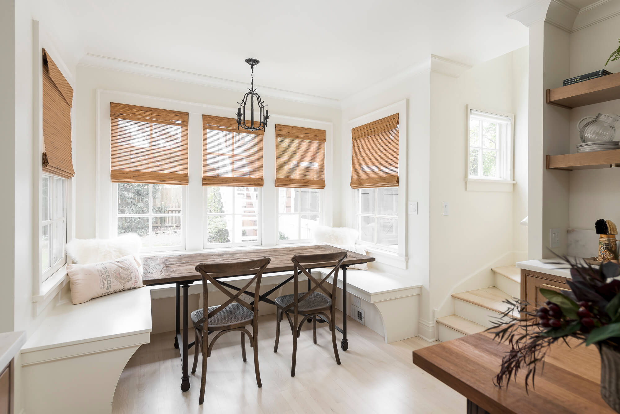 A built-in banquette seating area with Dura Supreme Cabinetry.