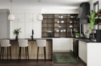 Glass cabinet doors with black metal door frames on white painted inset cabinets with a white oak cabinet interior, a skinny shaker style, and brass hardware.