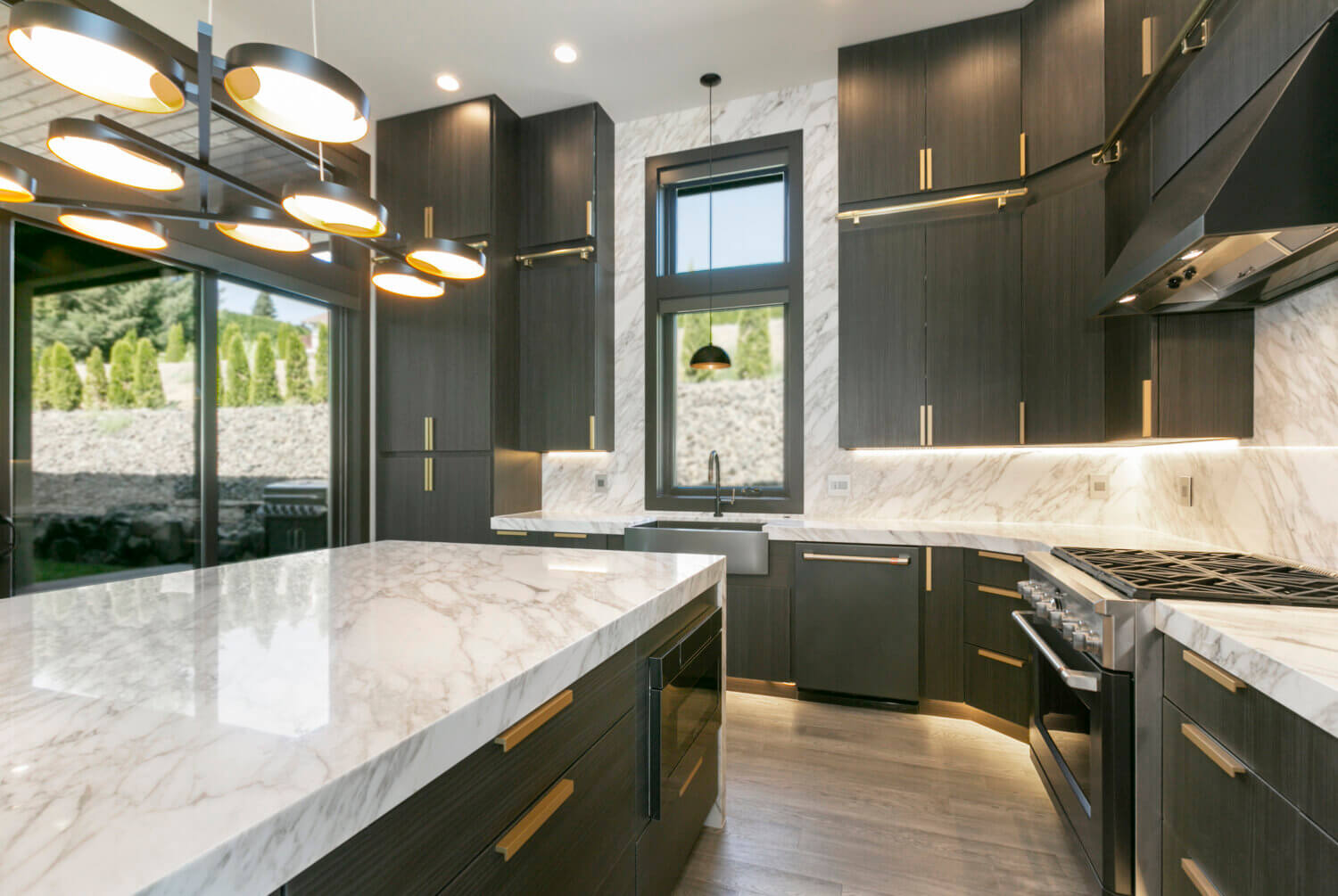 An all black kitchen with modern textured cabinets from Dura Supreme Cabinetry.