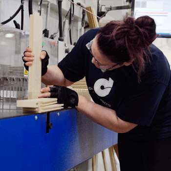 A cabinet maker at the Dura Supreme factory cutting cabinet door pieces for manufacturing and production. Dura Supreme is proud to be one of the first cabinetry manufacturers to achieve this certification.
