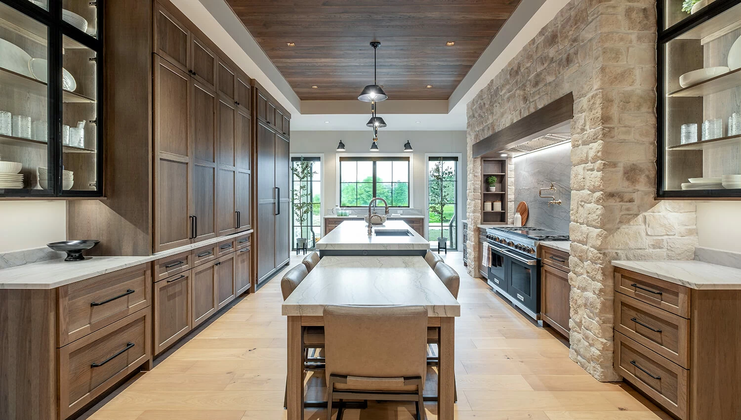 A galley styled kitchen featuring a medium true brown stained finish on hickory cabinets.