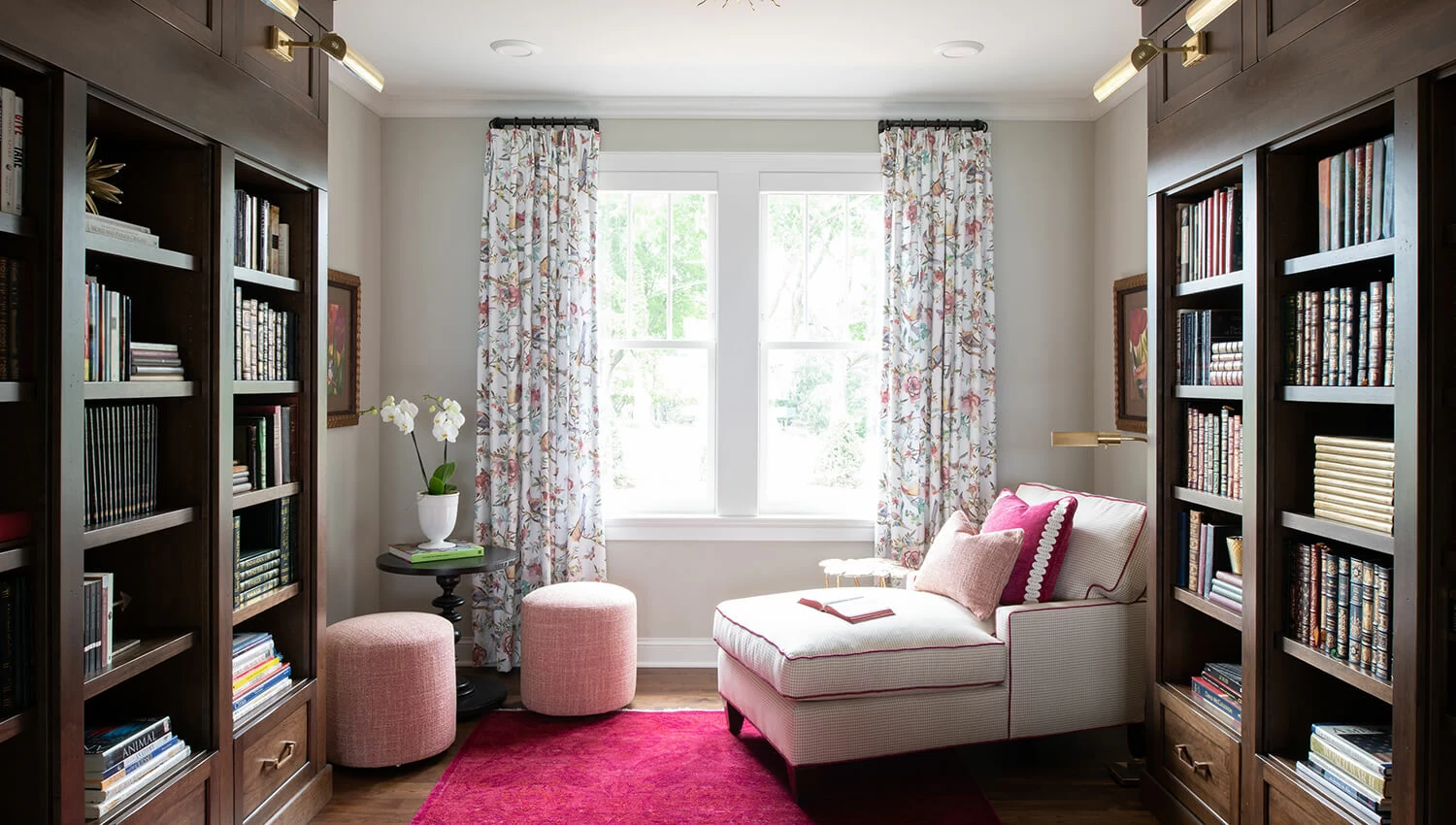 This delightful home library is a beautiful space to dive into a good book. The built-in bookcases by Dura Supreme are designed with the Campbell standard overlay door style in the Heirloom “O” finish on Cherry. 