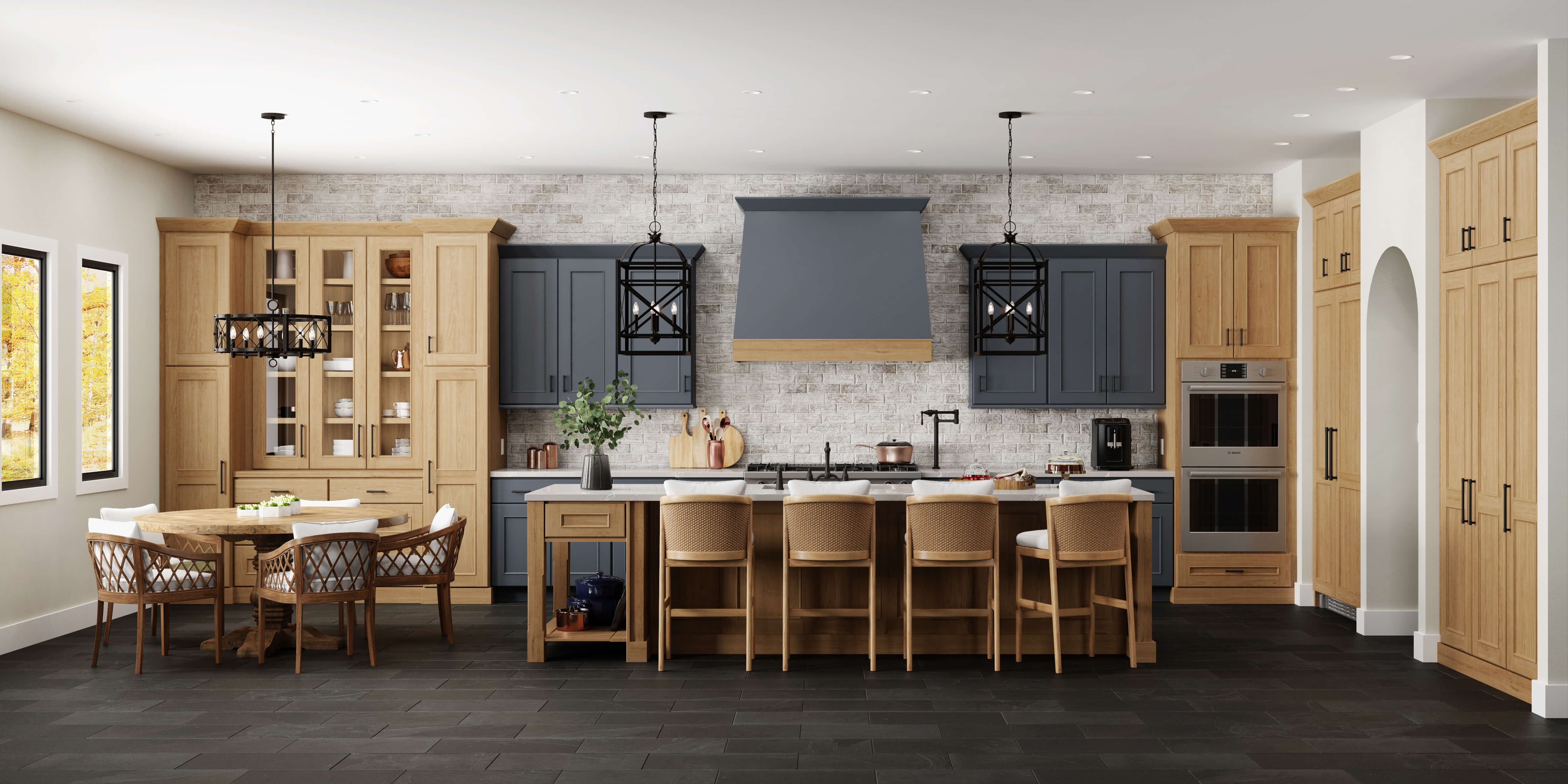 A modern English styled kitchen design with dark navy blue and light stained cherry wood cabinets.