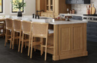 Beautifully stained cherry cabinets and kitchen island from Dura Supreme.