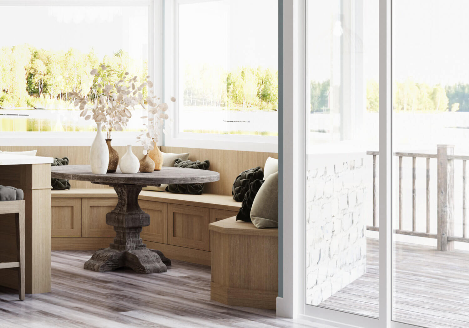 This dreamy lake house kitchen captures the home’s lake shore lifestyle with watery blue walls, shiplap ceilings, nature-inspired wood and white painted cabinetry, and natural stone accents. This dining room breakfast nook uses light white washed stain on Quarter Sawn White Oak cabinets.