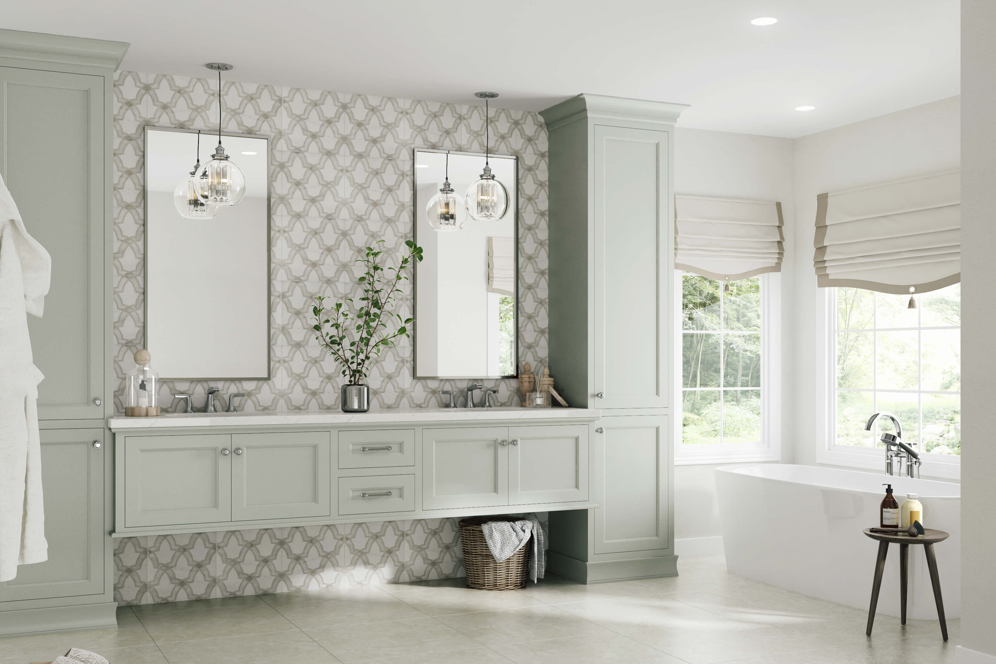 A modern and transitional style master bathroom with a floating vanity. The bathroom cabinets showcase a lovely light gray painted finish. The bathroom has large windows and a freestanding bath tub as well as a floor to ceiling backsplash that complements the color of the vanity cabinets.