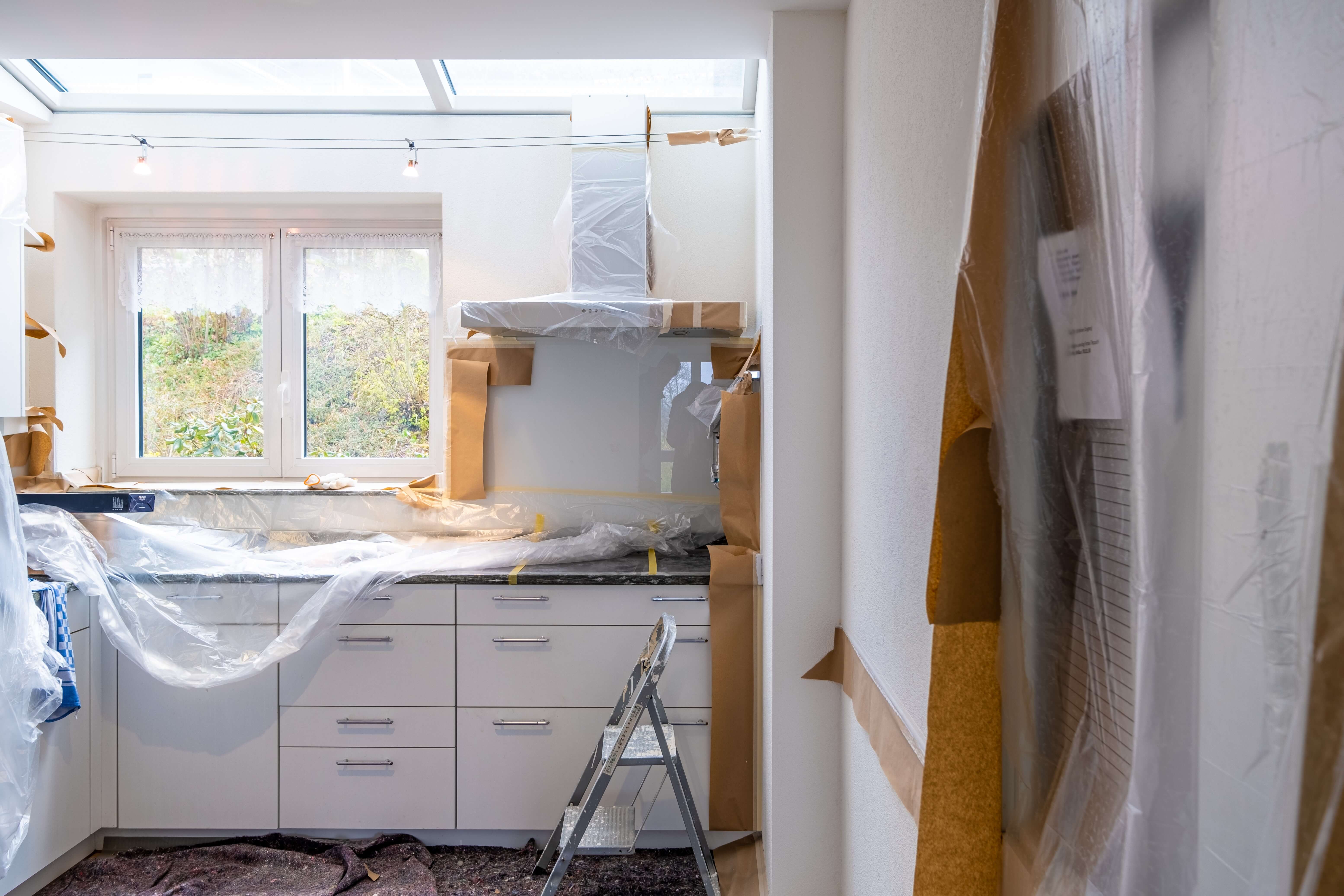 During renovation. The kitchen walls are prepared for painting a new color.