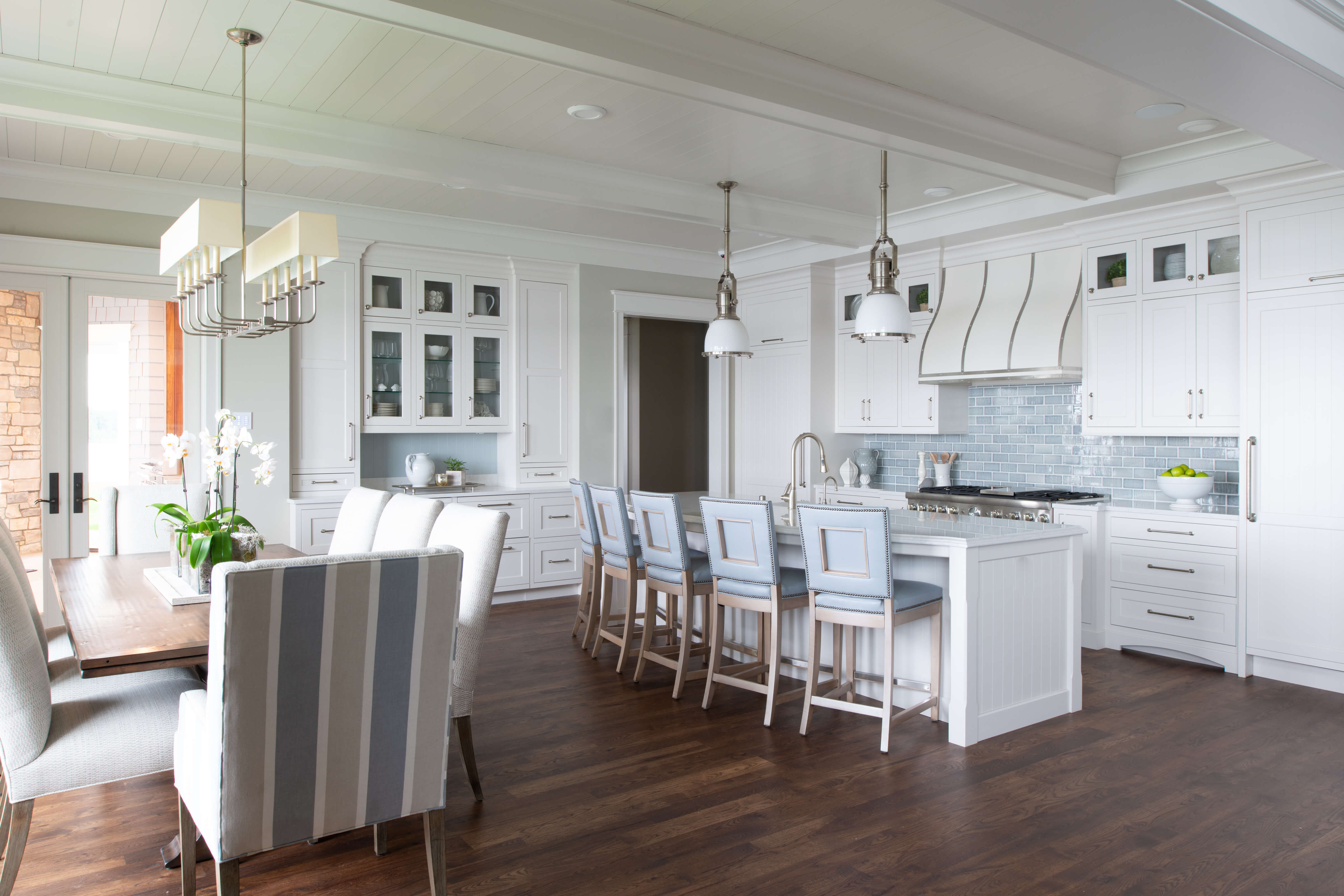 This fabulous, East coast, shingle styled home is full of inspiring design details! This new construction kitchen and scullery uses a combination of Dura Supreme’s Highland door style in both Inset and full overlay in the “Linen White” paint finish.
