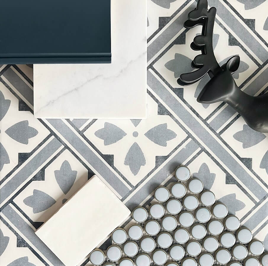 A gray, white, and black flat lay showing a kitchen design idea with a variety of cabinet, countertop, and tile finishes.