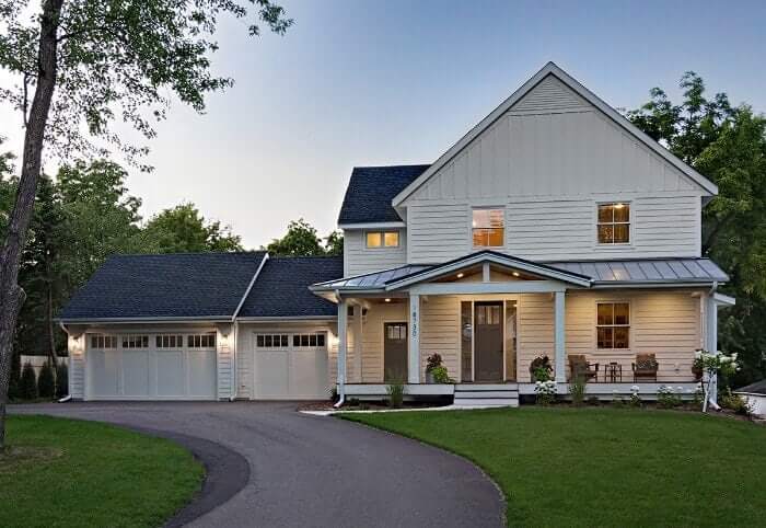 The exterior of a brand new custom home with a modern farmhouse style.