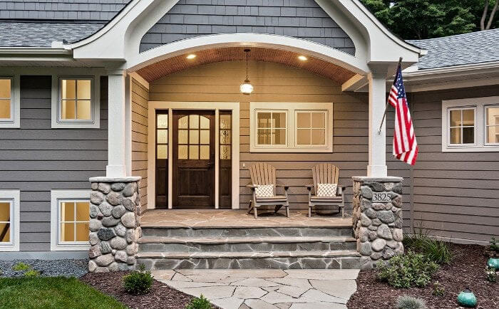 The exterior of a brand new custom home with a modern farmhouse style.