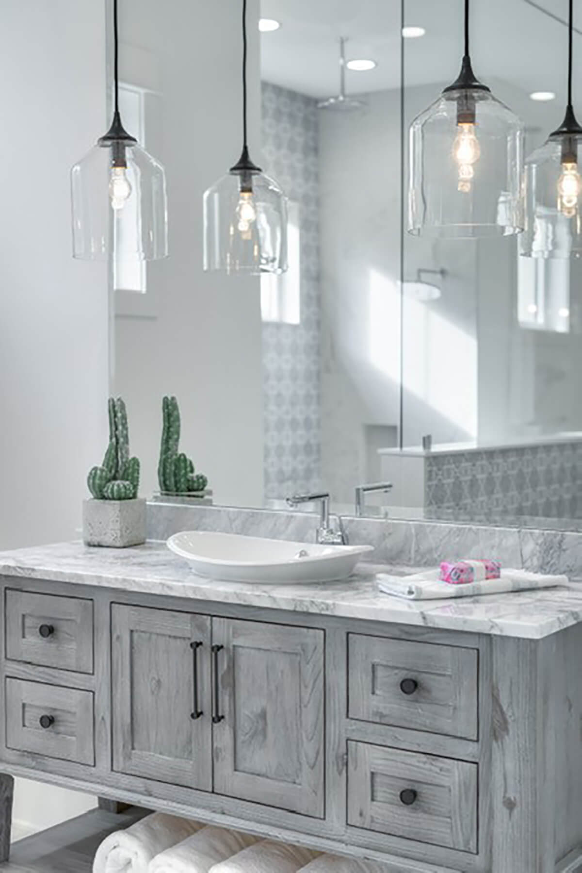 A driftwood bathroom vanity with a cool color palette inspired by the beach.