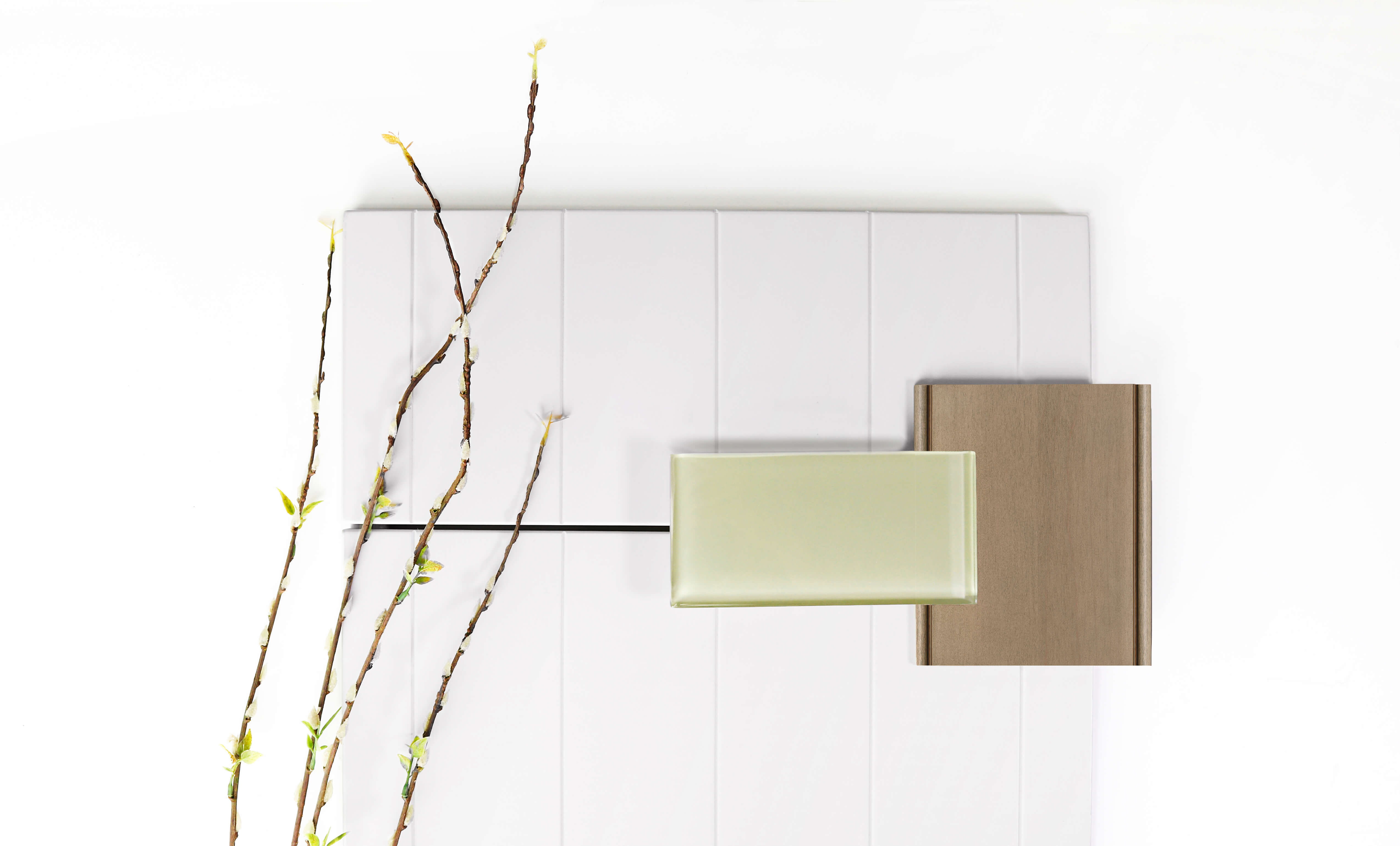 A natural color palette for a kitchen remodel using a shiplap door style in white paint with a light stained natural wood and a green subway tile.