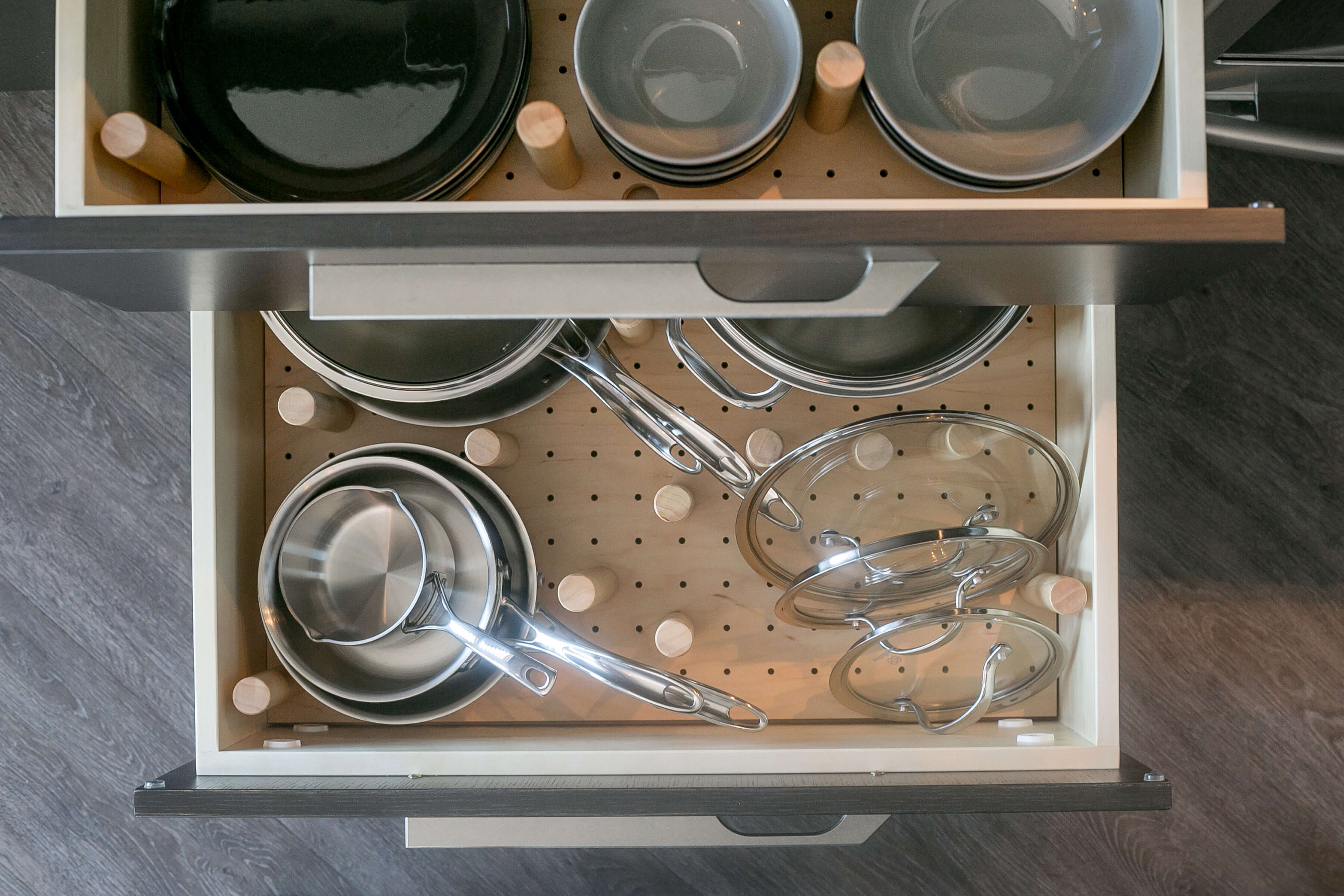 Pot & pan storage in a deep drawer with a storage rack.
