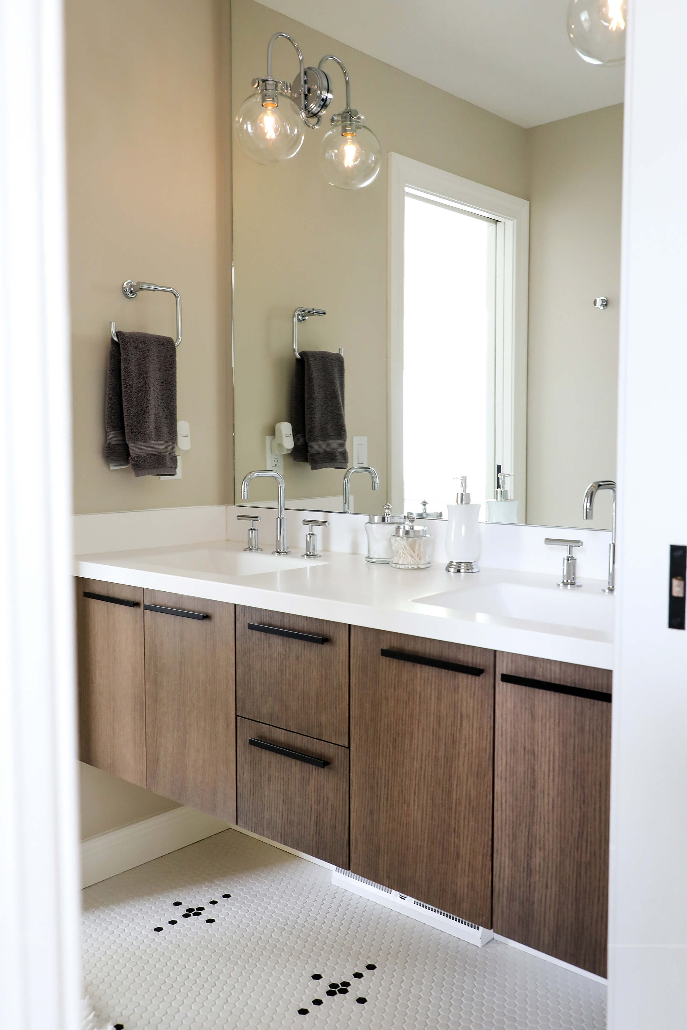 white bathroom cabinets with dark countertops