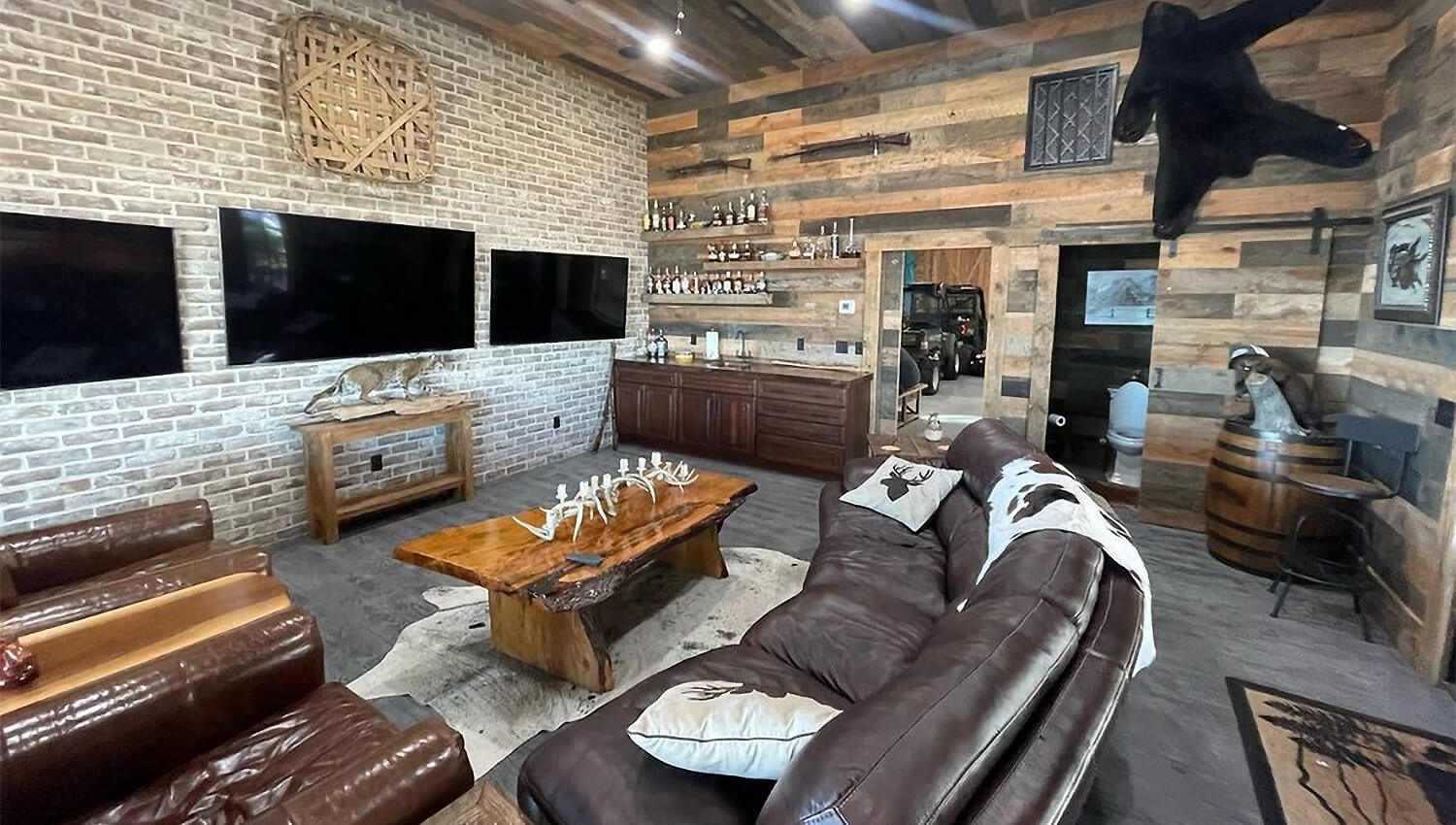 This Whiskey room design by Mevers Kitchen & Bath features a rustic wet bar with Dura Supreme Cabinetry.