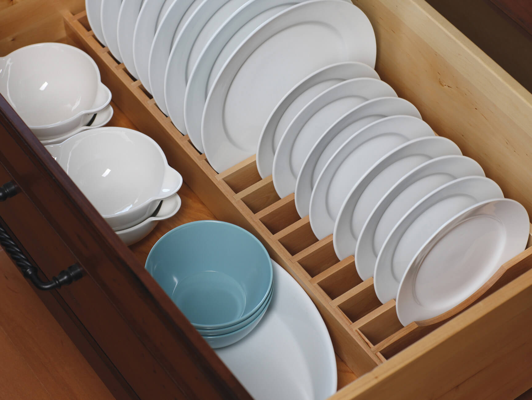 A Plate Rack Drawer creates a convenient location and a unique way to store an entire set of dishware within easy reach.