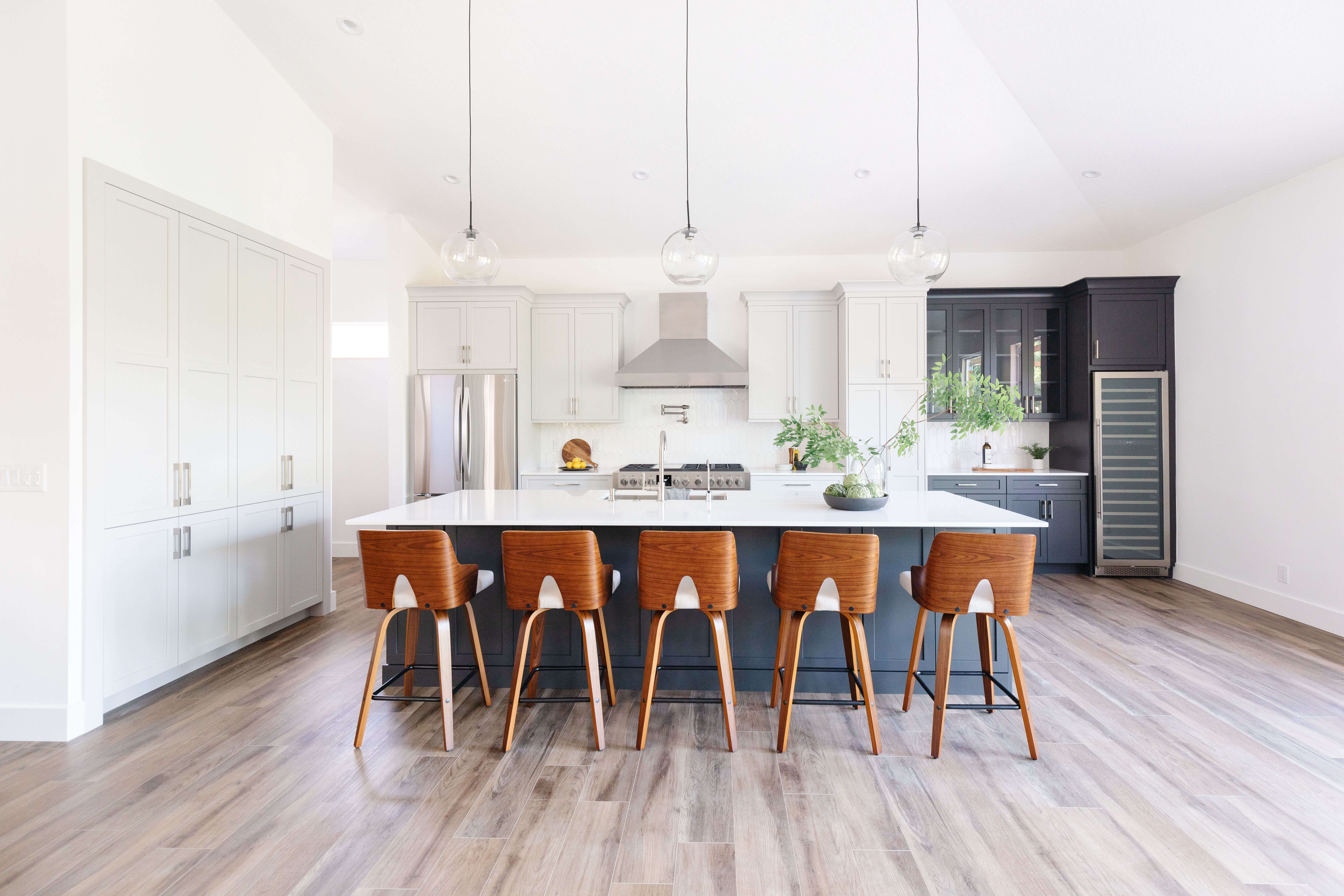 A beautiful Mid-Century Modern kitchen remodel with a black and white color palette.