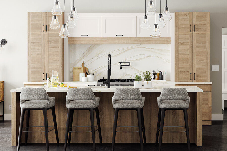 A scandinavian styled kitchen with a natural inspired color palette with raw wood textures and fresh white painted cabinets.