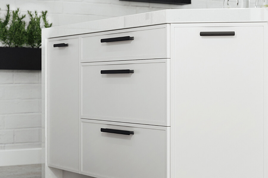 A close up of a modern shaker door styly with thin rails and styles around the cabinet door.