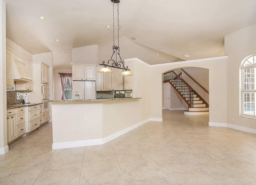 The before photo of the kitchen in the center of the home.