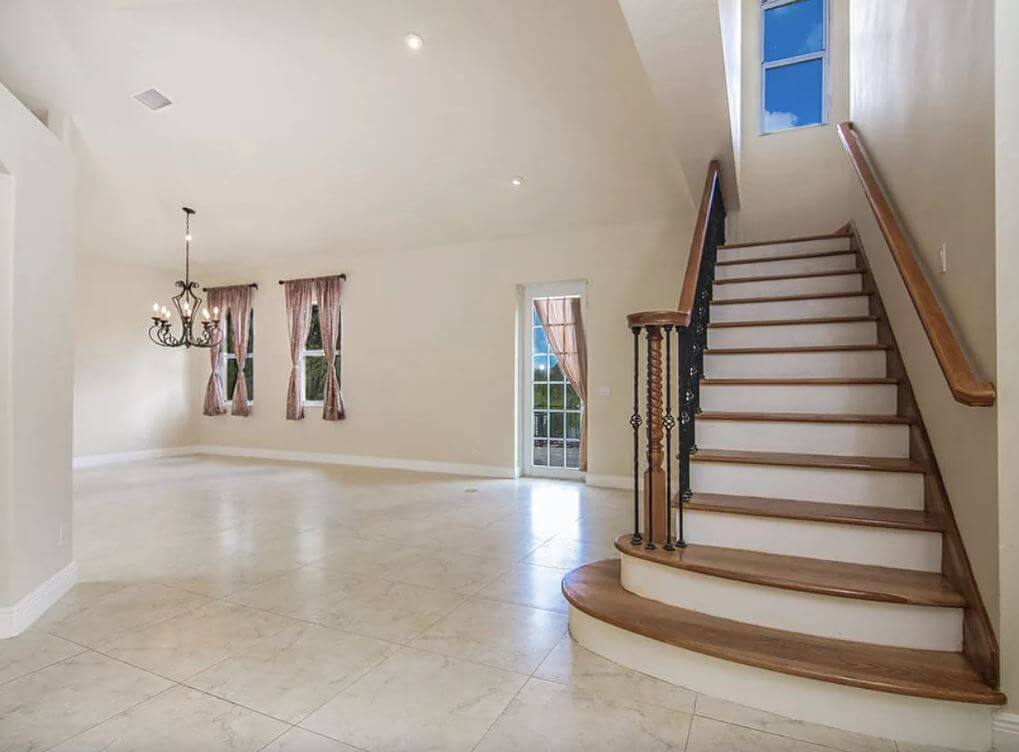 A before picture of the dining room towards the back of the home.