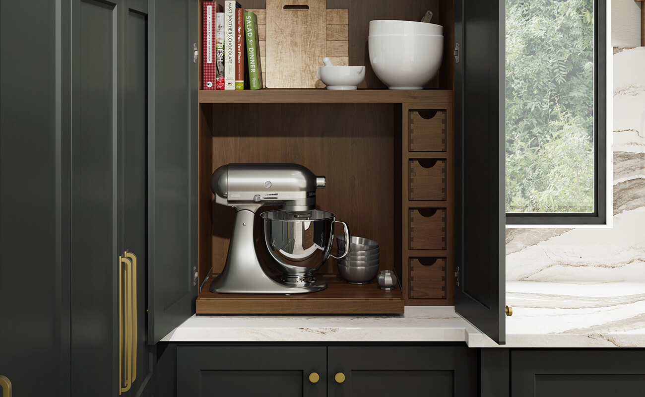 A baking center larder cabinet with a trendy working pantry in a dark green paint.