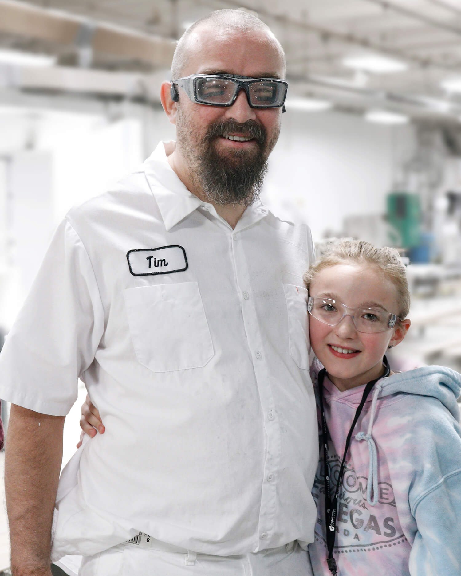 Father and daughter in a cabinet manufacture tour for bring your daughter to work day.
