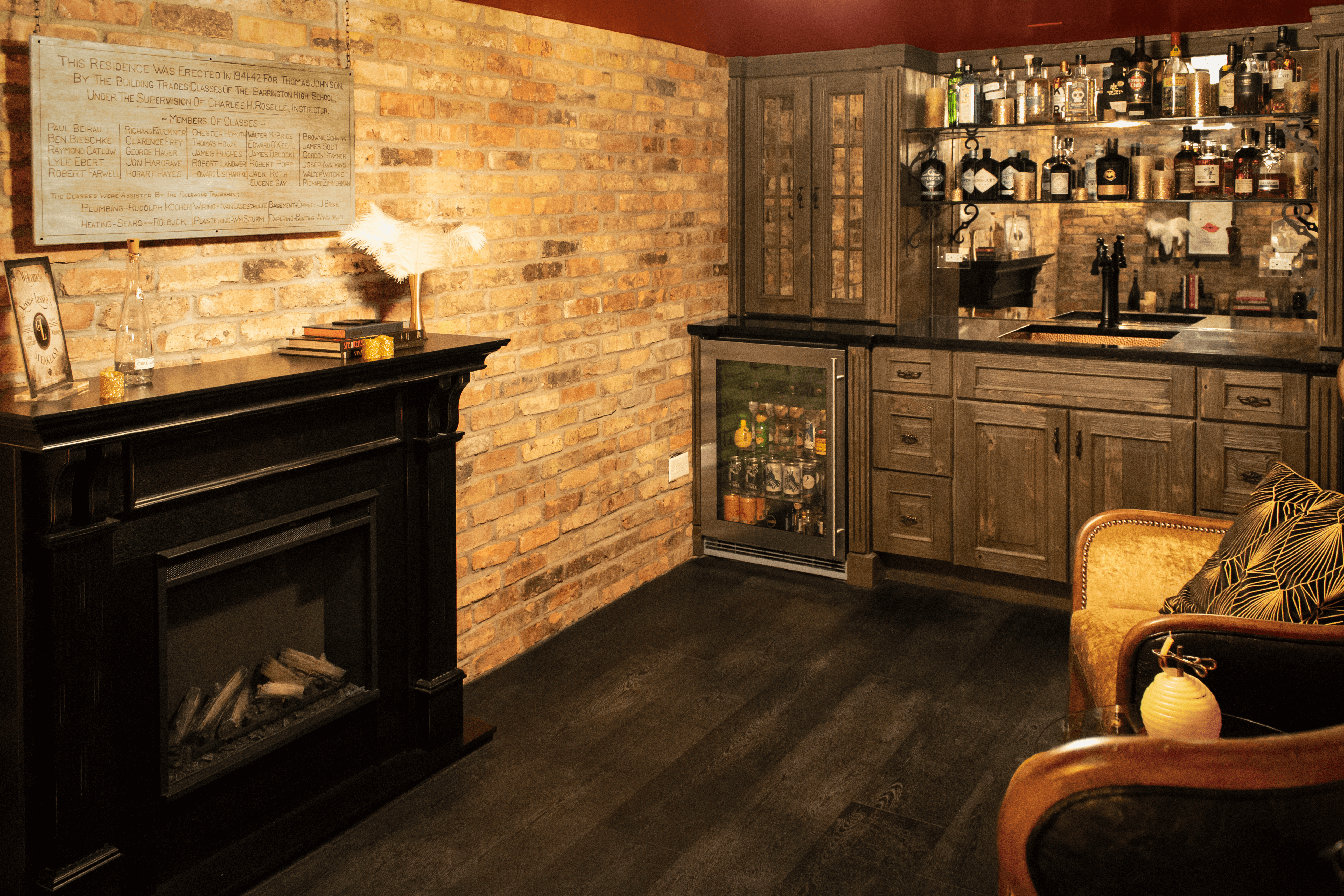 A hidden speak easy style wet bar and fireplace mantel.