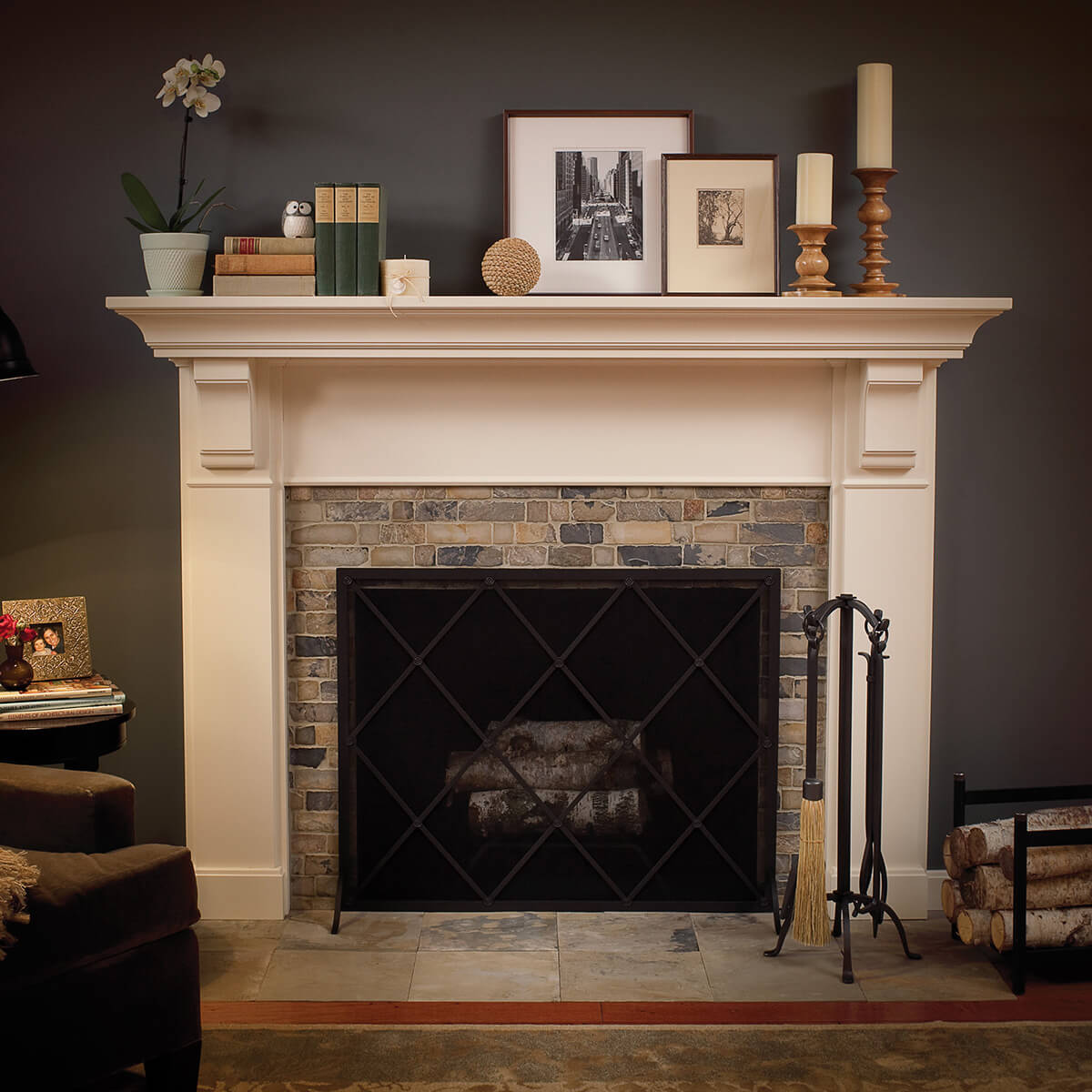 A cottage style fireplace mantel in a traditional home made by Dura Supreme Cabinetry.
