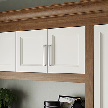 A close up of built-in cabinets in a home office with a dramtic, deep centerpanel in the