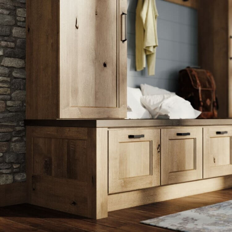 A close up of a knotty alder boot bench and locker with entryway storage from Dura Supreme Cabinetry.