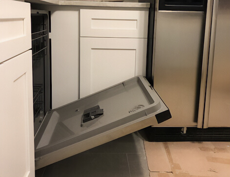 The dishwasher clearance was not considered during the design process. The fridge and the dishwasher doors hit each other.