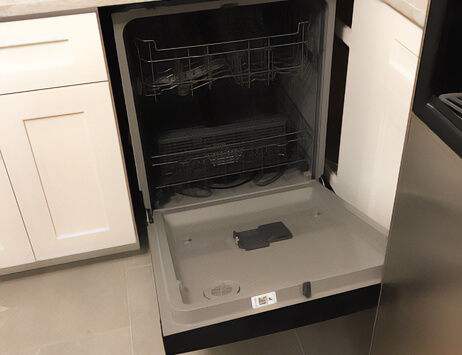 A straight on view of the dishwasher door hitting the fridge when it's opened.