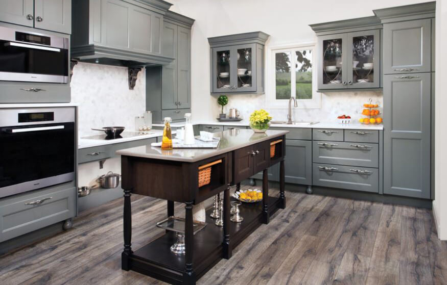 This all gray kitchen has clashing gray colors. The cabinets have a gray-green undertone while the floor has a gray-purple undertone.