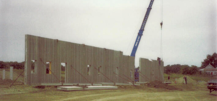 In 1979 when the first wall was started for the construction of the Dura Supreme Cabinetry headquarters in Minnesota.