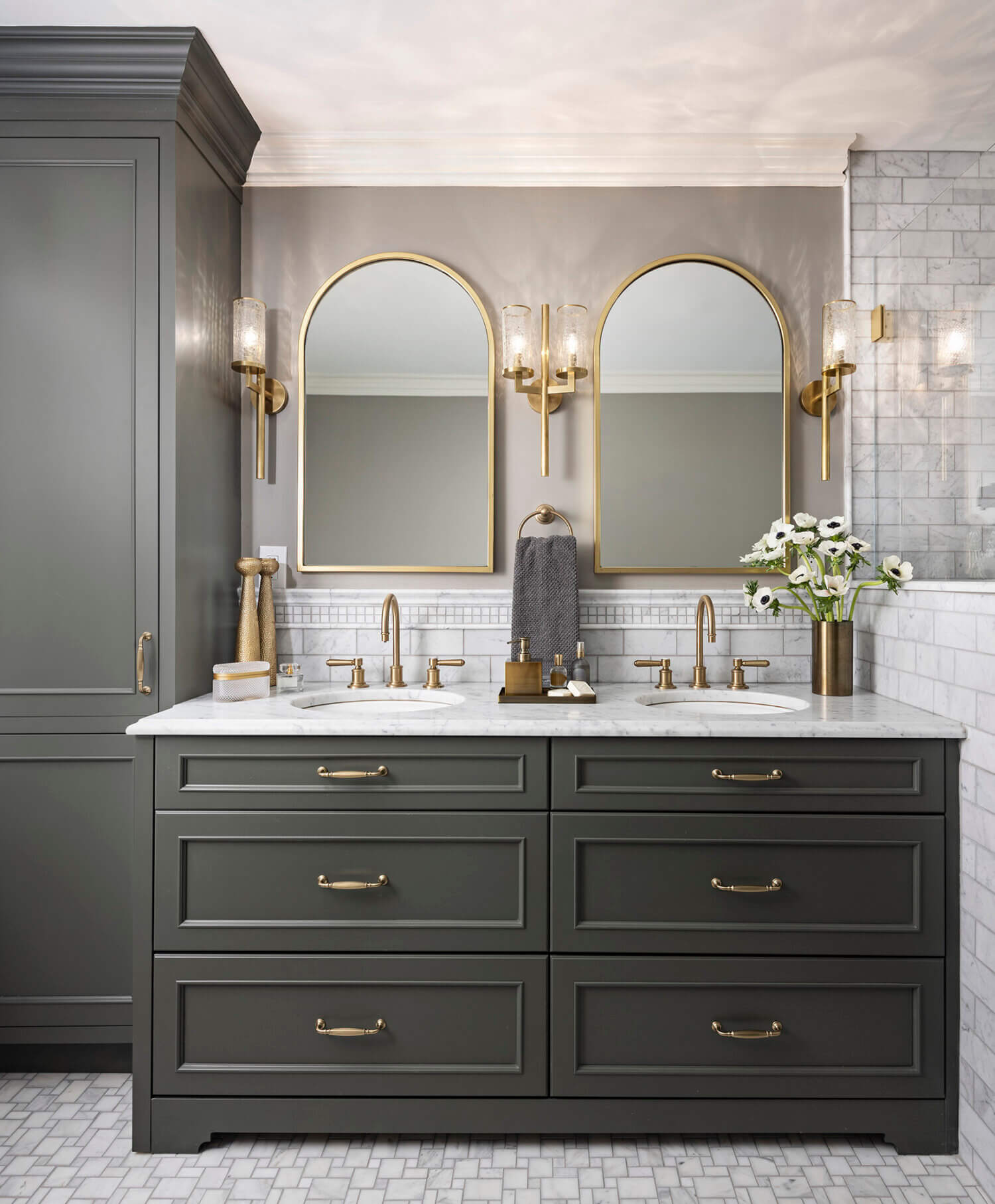 A furniture styled bathroom vanity with almost black, dark green cabinets from Dura Supreme.