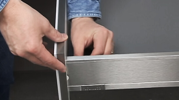How to adjust and install stainless steel metal drawers from Dura Supreme Cabinetry.