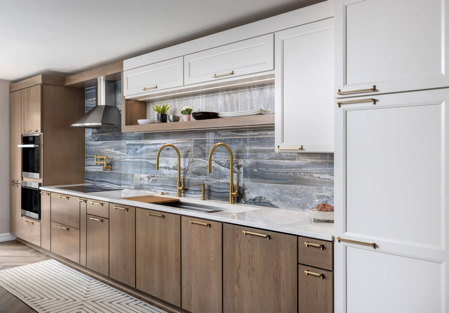 A two-toned one-wall kitchen with white and medium stained cabinets from Dura Supreme.