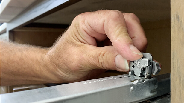 How to adjust drawer guides for installing Dura Supreme Cabinetry.