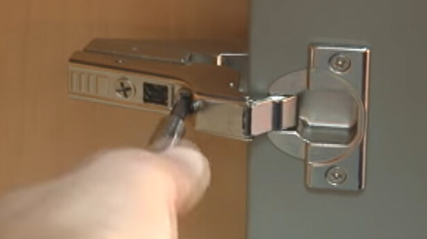 How to adjust an inset cabinet door hinge that is concealed.