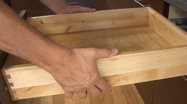 How to remove and install cabinet drawers and roll-out shelves from Dura Supreme Cabinetry.