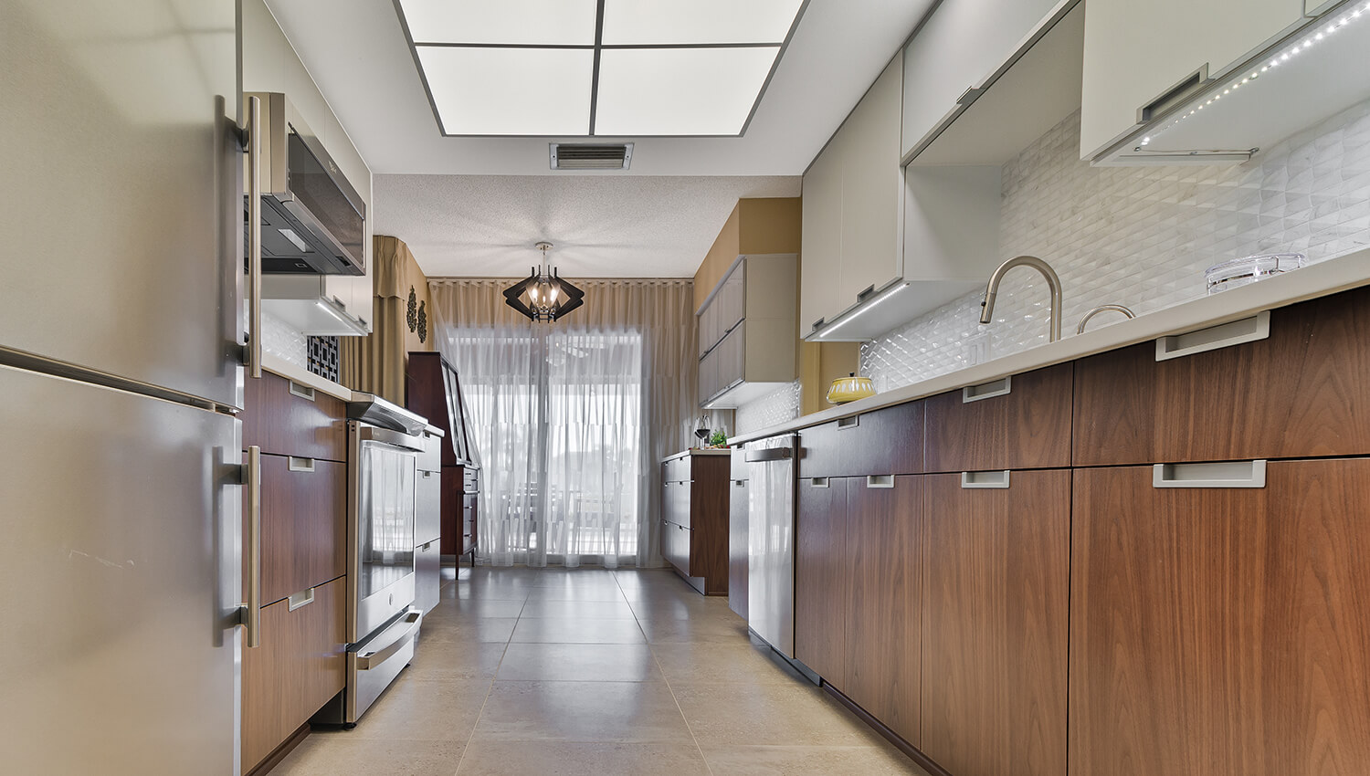 A galley kitchen design with mid-century modern style kitchen cabinets.