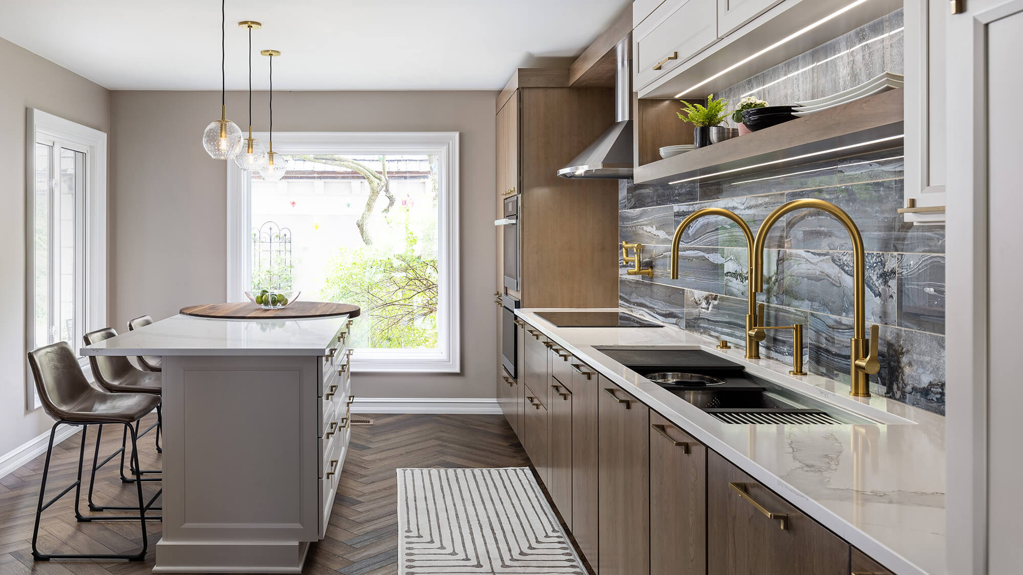 A two-toned one-wall kitchen with a color palette of white, greige, and medium stained woods.
