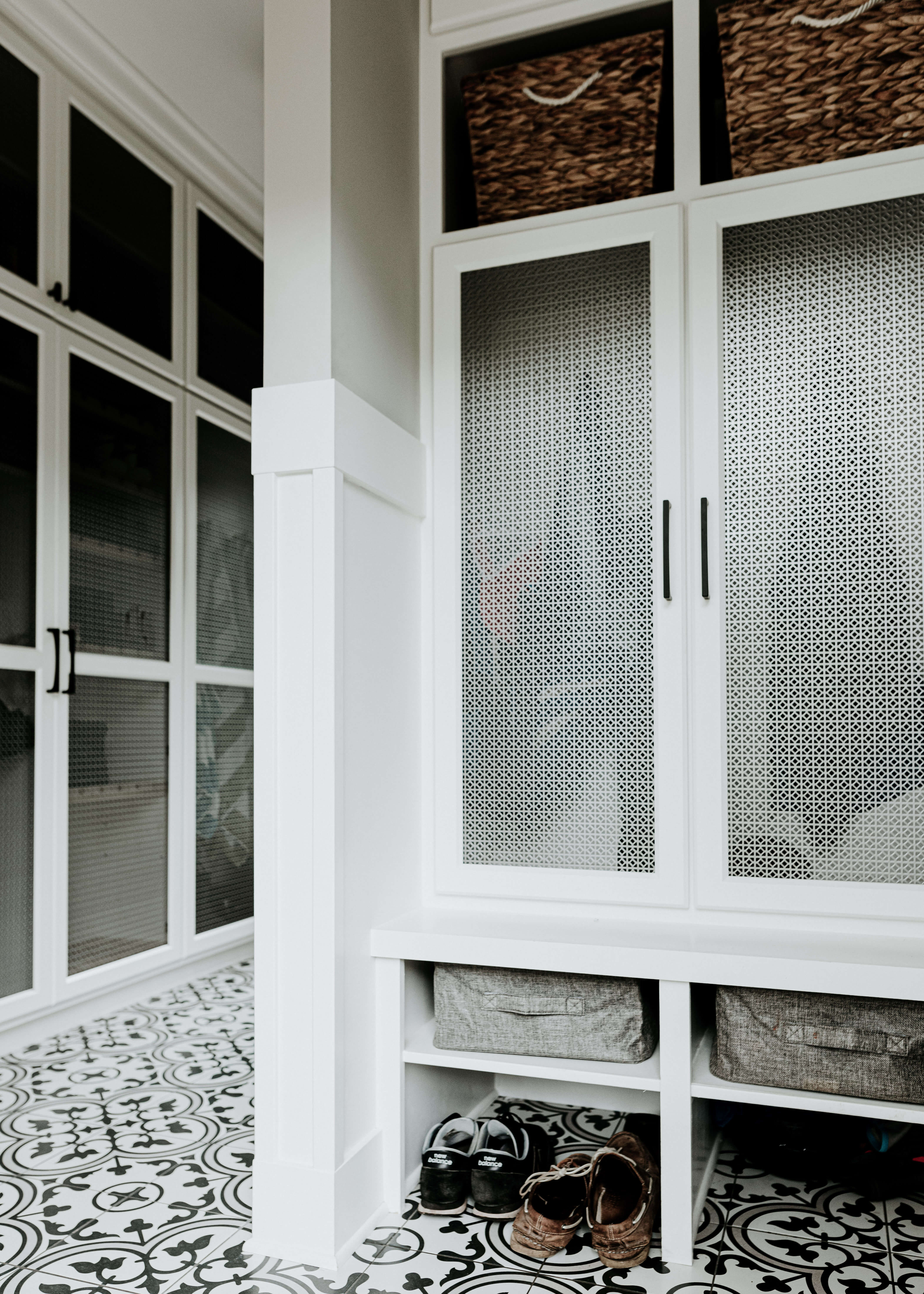 A hallway entryway with built-in mudroom storage.