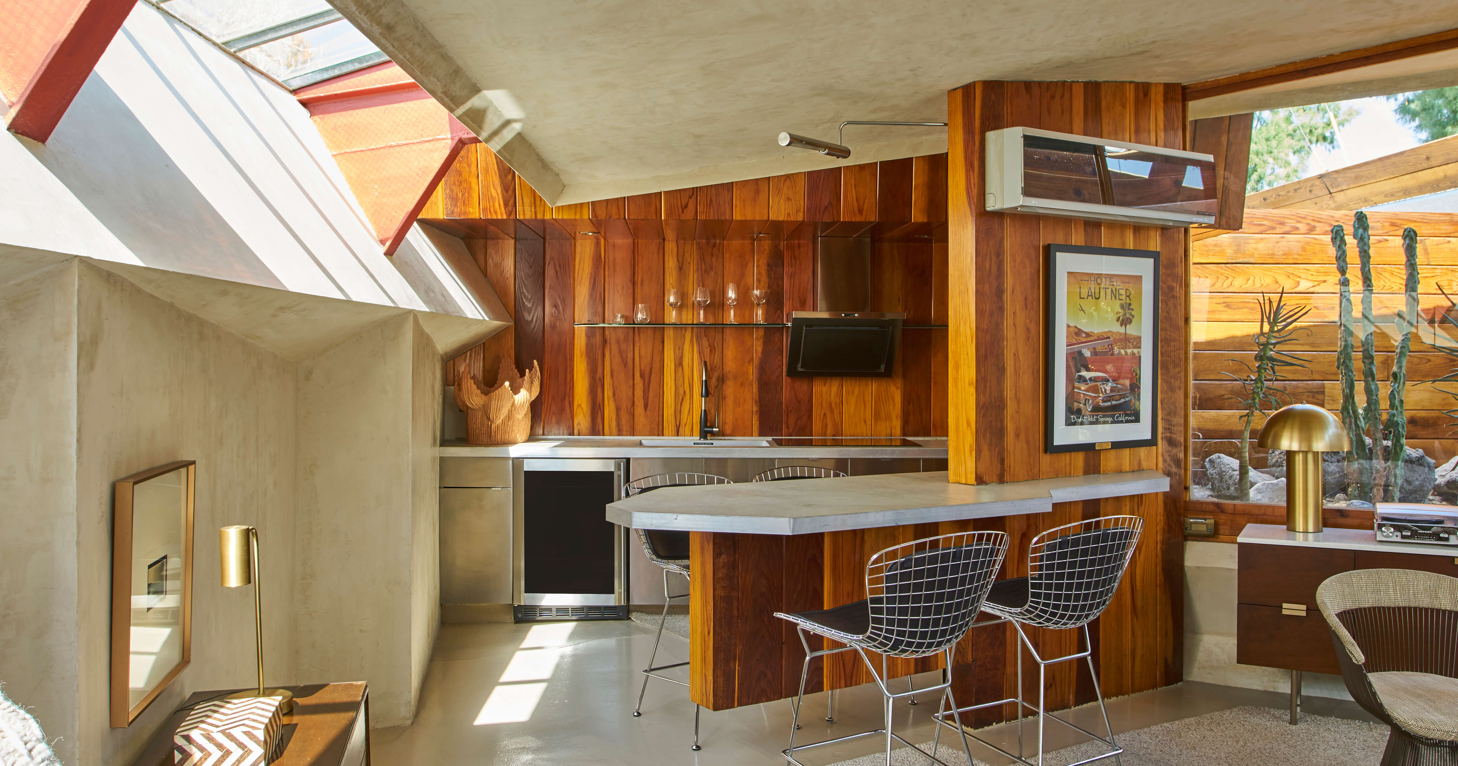 A midcentury modern kitchen design in a home designed by John Lautner.